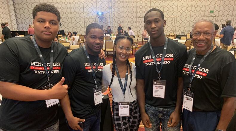 From left, Thurgood Marshall senior Chaz Amos, Dayton Public Schools Males of Color facilitator Joshua Nalls, Boston student Vikiana Petit-Homme, Dunbar senior Marcellis Thompson and Dayton City Commissioner Jeff Mims take a break during the National Conference of Mayors’ Youth Summit in Los Angeles on July 26. CONTRIBUTED PHOTO