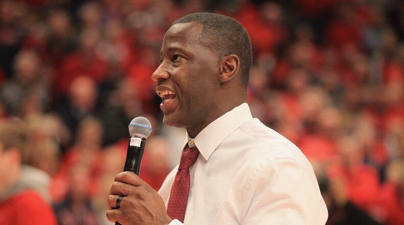 Dayton’s Anthony Grant talks to the crowd after a victory against George Washington on March 7, 2020, at UD Arena. David Jablonski/Staff