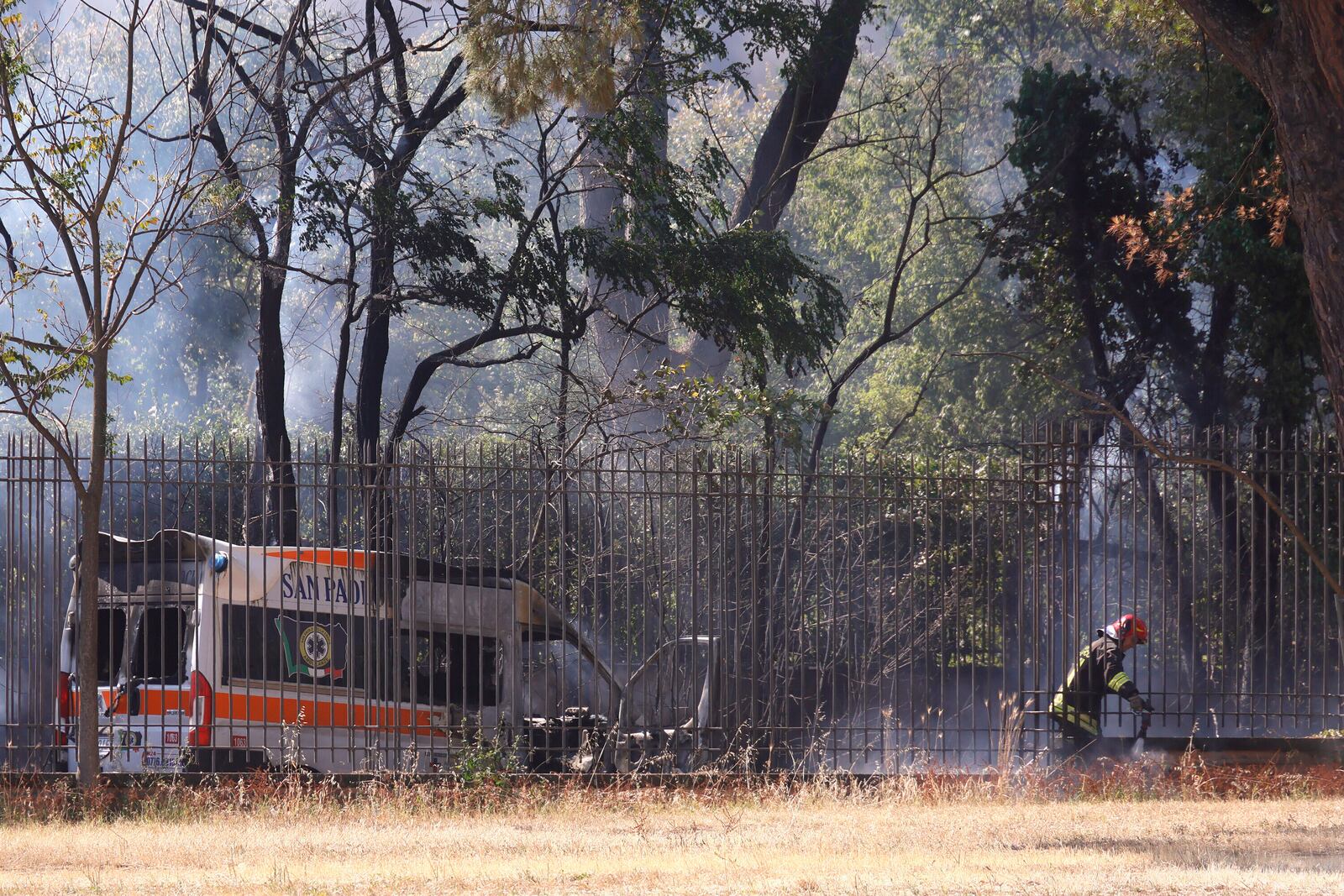 Emergency services work as smoke rises after a gas station exploded on the outskirts of Rome, Friday, July 4, 2025. (Cecilia Fabiano/LaPresse via AP)