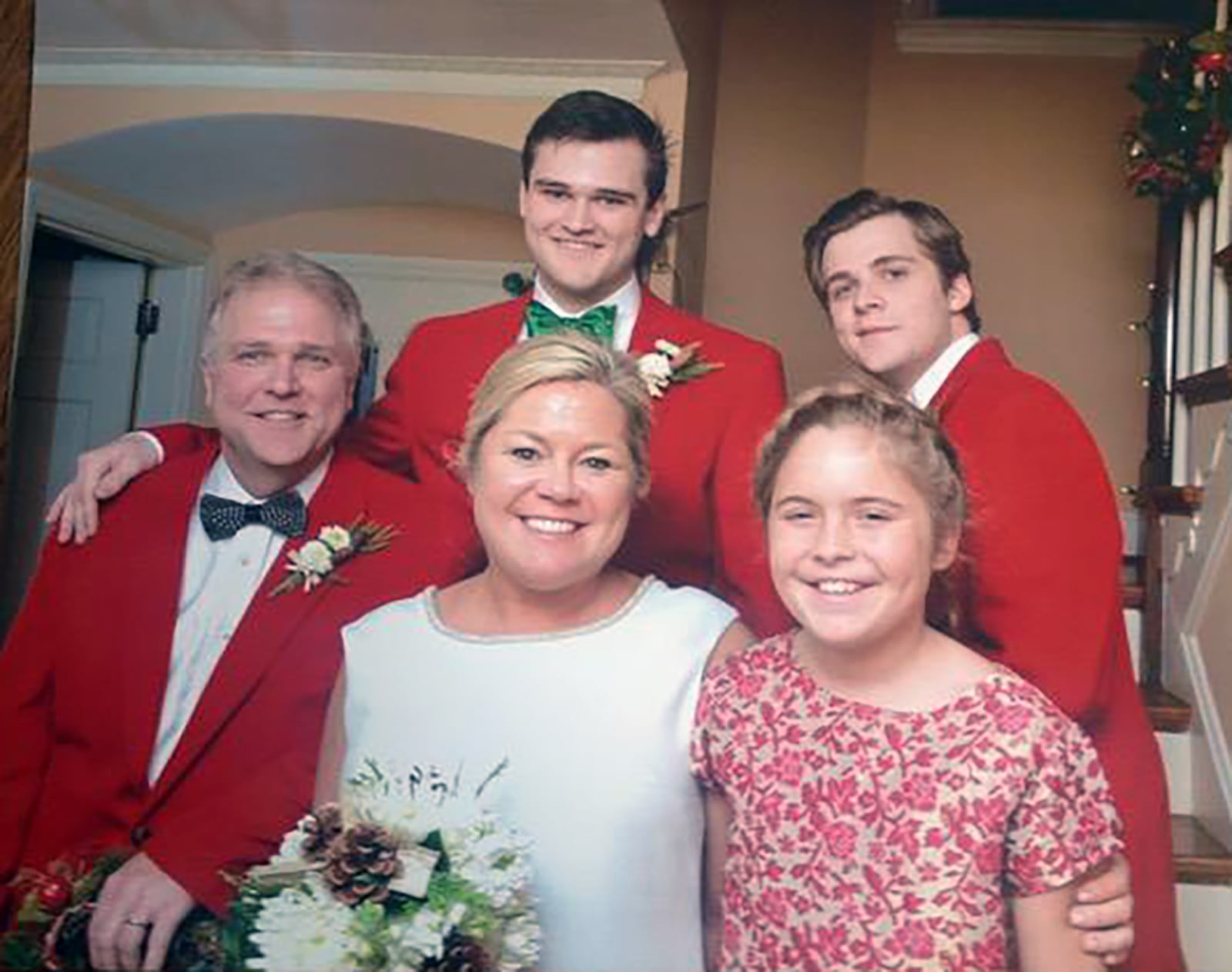 Carrie Dorger (front center) with her family on her wedding day in 2013. Left to right: husband Matt Dorger, Carrier, daughter Lucy. Back Left to right, stepsons Max and Jake Dorger. Dorger's family encouraged her to find another job and her husband suggested a business. CONTRIBUTED