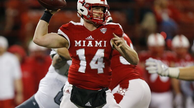 OXFORD, OH - NOVEMBER 15: Gus Ragland #14 of the Miami Ohio Redhawks throws a pass against the Eastern Michigan Eagles during the second half at Yager Stadium on November 15, 2017 in Oxford, Ohio. (Photo by Michael Reaves/Getty Images)