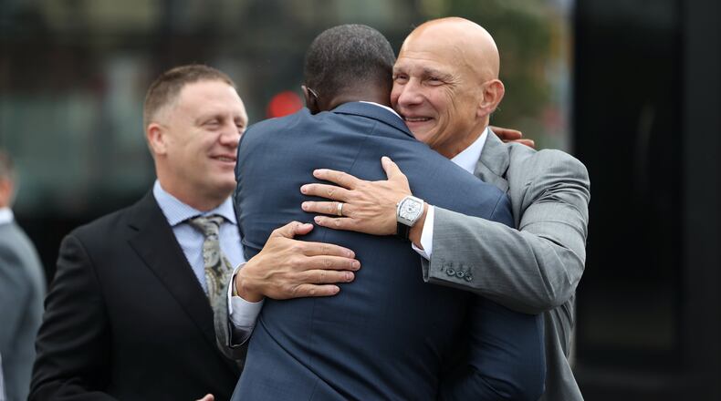 Dayton's Anthony Grant gets a hug from Massachusetts coach Frank Martin at Atlantic 10 Conference Media Day on Thursday, Oct. 13, 2022, at the Barclays Center in Brooklyn, N.Y. David Jablonski/Staff