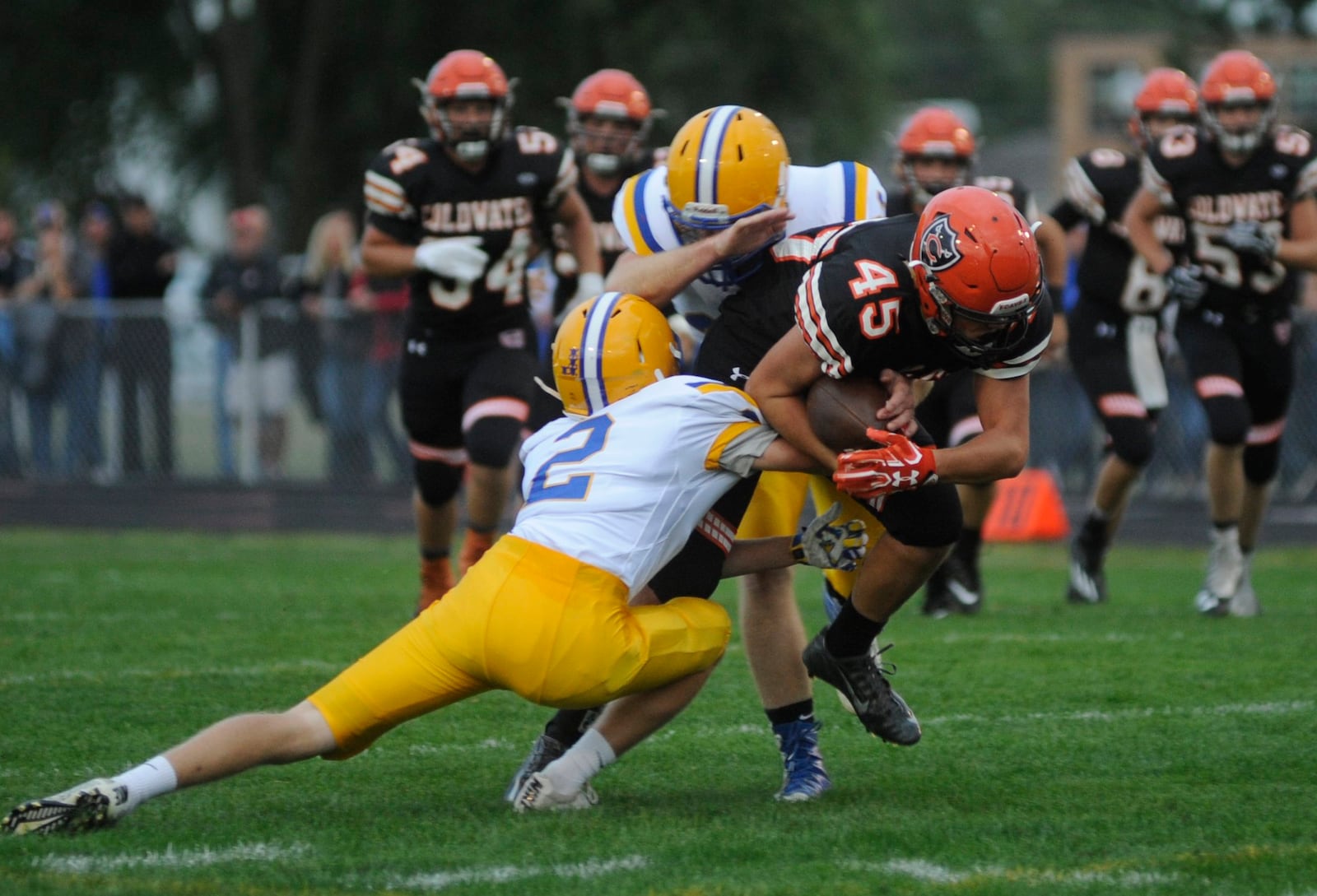 Marion Local defender Tyler Prenger (2) takes down Coldwater’s Caleb Dippold during a Sept. 8 game at Coldwater. Marion Local won 13-7. MARC PENDLETON/STAFF