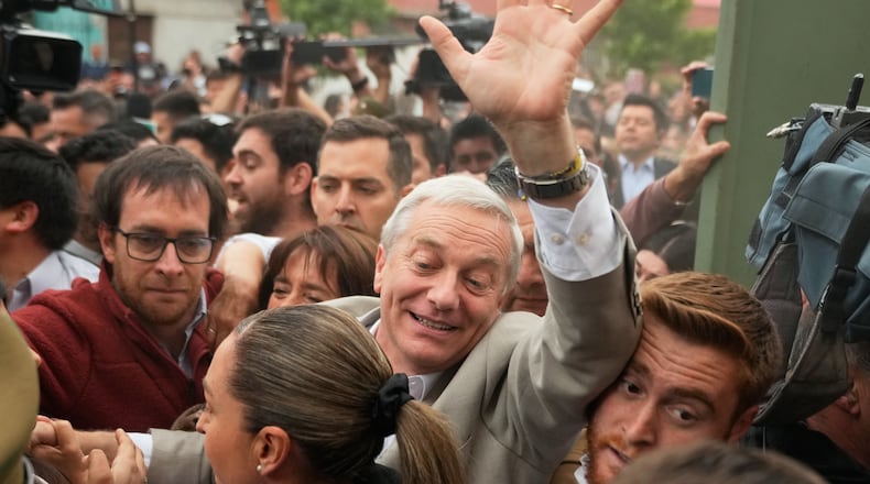 Jose Antonio Kast, presidential candidate for the Republican Party, arrives to vote during the presidential runoff election in Santiago, Chile, Sunday, Dec. 14, 2025. (AP Photo/Matias Delacroix)
