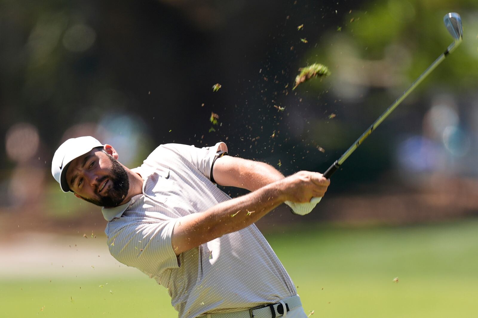 Scottie Scheffler hits from the fairway of the eighth hole during the first round of the RBC Heritage golf tournament, Thursday, April 17, 2025, in Hilton Head Island, S.C. (AP Photo/Mike Stewart)