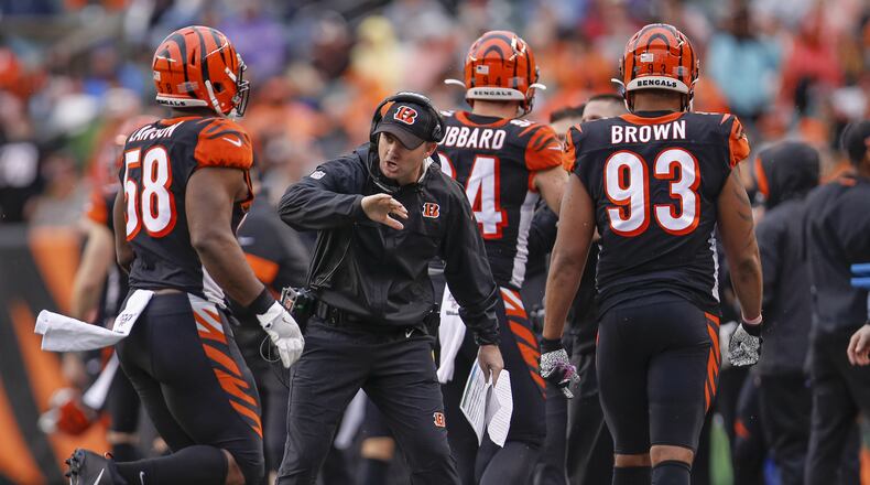 CINCINNATI, OH - DECEMBER 29: Head coach Zac Taylor celebrates with Carl Lawson #58 of the Cincinnati Bengals during the second half against the Cleveland Browns at Paul Brown Stadium on December 29, 2019 in Cincinnati, Ohio. (Photo by Michael Hickey/Getty Images)