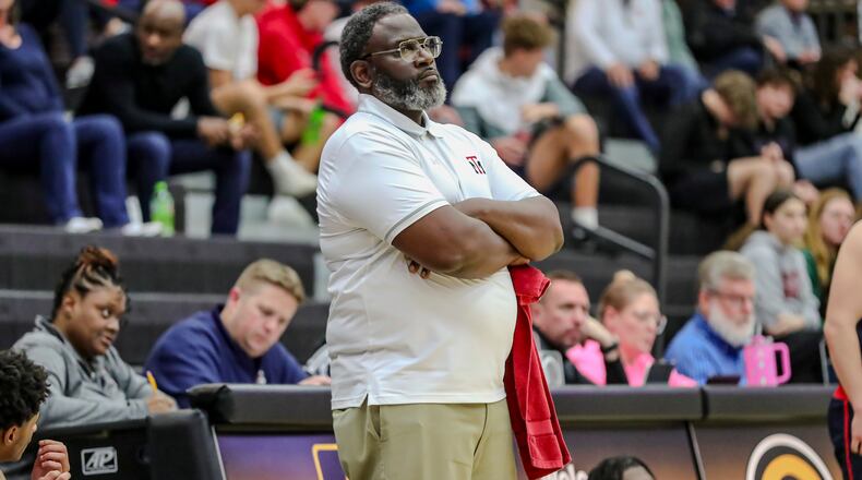 Trotwood Madison High School boys basketball Carl Blanton, Sr. stands on the sideline during his team's Piqua 79-22 in a Division III district semifinal game on Tuesday, Feb. 26, at Centerville High School. MICHAEL COOPER/STAFF PHOTO