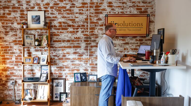 JJR Solutions C.E.O., Dave Judson works in his office in the Avant Garde Building on East Third Street in downtown Dayton. JIM NOELKER/STAFF
