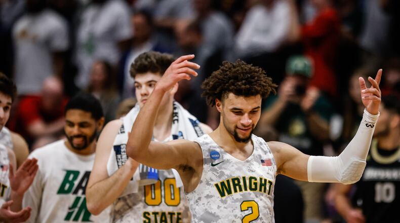 WSU guard, Tanner Holden reacts to his teams first NCAA tournament win at UD Arena Wednesday night. JIM NOELKER/STAFF