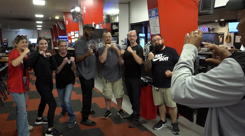 Former heavyweight boxing champion Lamon Brewster (center) was at Pohlman Lanes on Monday, June 10, 2024, in Hamilton, to drum up support for a possible event with fellow former boxing champ Buster Douglas, who was in Hamilton earlier in the day on Monday, June 10, 2024. JEFF ARCHIABLE/TVHAMILTON