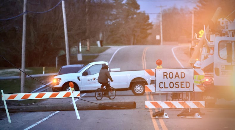 A large tree took out a couple of electric poles Sunday and had Dayton Road blocked between Springfield and Enon. BUCK CREEK PHOTOGRAPHY