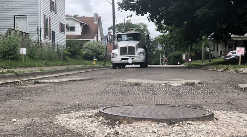 Muncie Street in Dayton’s Belmont neighborhood was grinded down in preparation to be repaved. A truck with A&B Asphalt was parked on the street. CORNELIUS FROLIK / STAFF