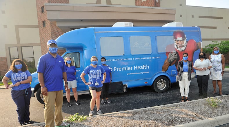 Employees of Premier Health, deliverd COVID-19 kits Tuesday, at various churches, made possible from the 2020 virtual African American Wellness Walk. The African American Wellness Walk promotes physical, mental, emotional, and social health and justice in the community. MARSHALL GORBY\STAFF
