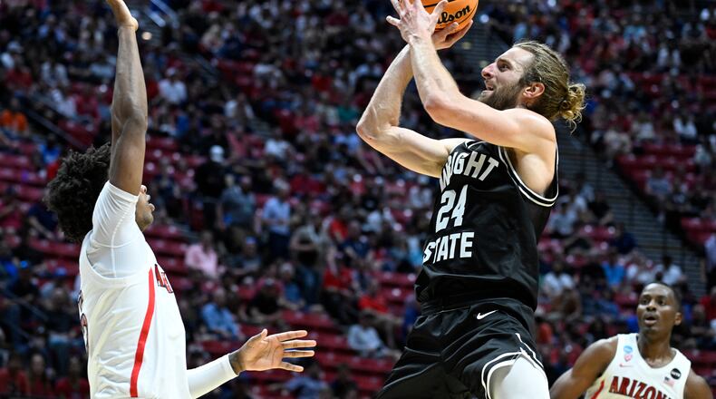 Wright State guard Tim Finke (24) shoots against Arizona during the first half of a first-round NCAA college basketball tournament game, Friday, March 18, 2022, in San Diego. (AP Photo/Denis Poroy)