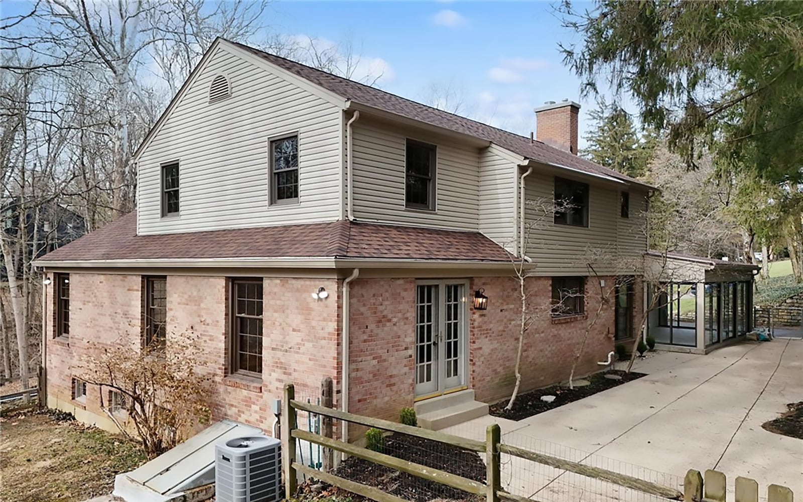The back of the home has a screened porch and a concrete patio that runs the length of the house. The yard is partially fenced. CONTRIBUTED
