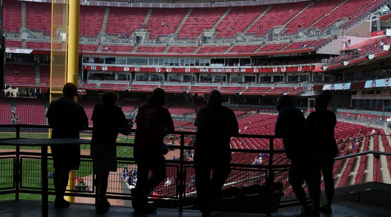 Fans stand in the concourse at Great American Ballpark prior to a baseball game between the Chicago Cubs and the Cincinnati Reds in Cincinnati on Sunday, May 2, 2021. (AP Photo/Jeff Dean)