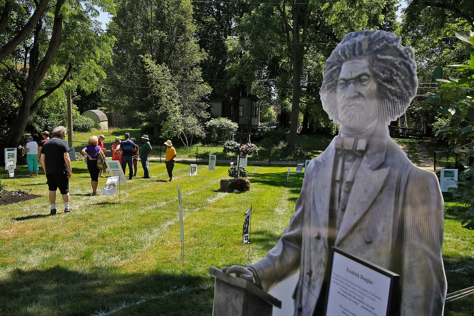 A lifesize cutout of Fredrick Douglas greets visitors at the end of the Discovery Walk through the Underground Railroad safe houses and secret codes along Route 68 from the Ohio River to Lake Erie behind the Gammon House Saturday, June 15, 2024 during the annual Juneteenth and Fatherfest Celebration. BILL LACKEY/STAFF
