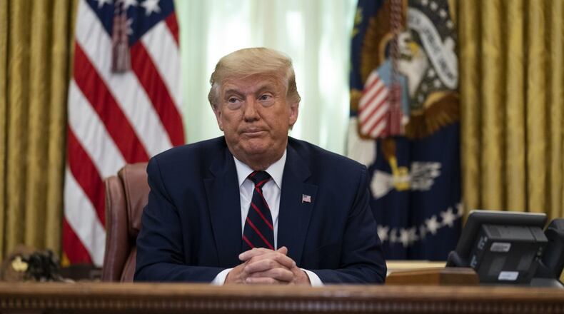 President Donald Trump, shown in the Oval Office of the White House, Friday, Sept. 4, 2020, in Washington, said he won't allow the Pentagon to cut funding for the military's independent newspaper Stars and Stripes, effectively halting plans to shut down the paper.
