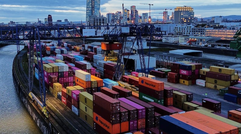Containers are stored in a cargo terminal in Frankfurt, Germany, Monday, Feb. 23, 2026. (AP Photo/Michael Probst)