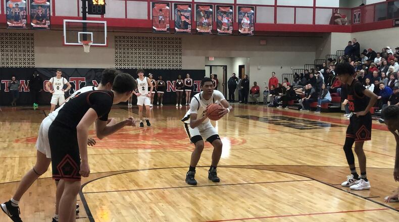 Centerville’s Mo Njie shoots a free throw during Friday night’s Division I tournament game vs. Wayne at Trotwood-Madison. Jeff Gilbert/CONTRIBUTED