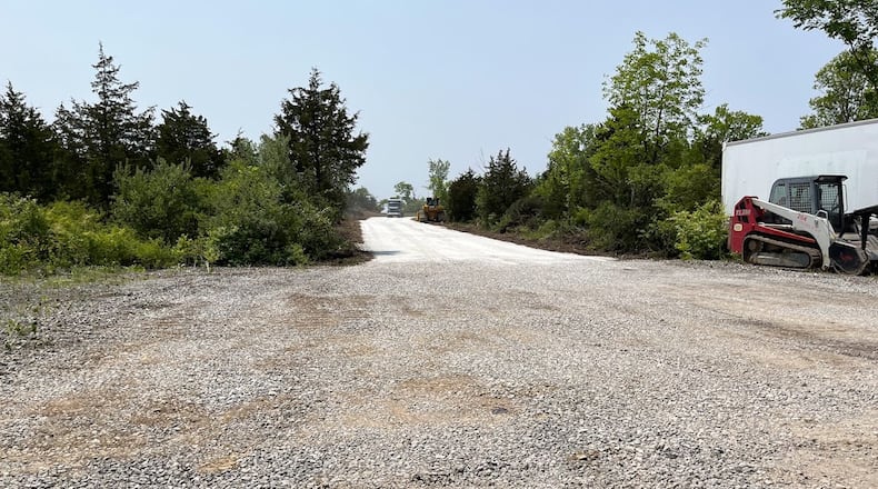 A new gravel road just east of the CenterPoint Energy Dayton Air Show's general admissions parking field off Northwoods Boulevard and North Dixie Drive. Air Show officials said Thursday motorists coming off Interstate 75 onto Northwoods this summer will be able to access general admissions parking much earlier, near where Engle Road meets Northwoods. THOMAS GNAU/STAFF