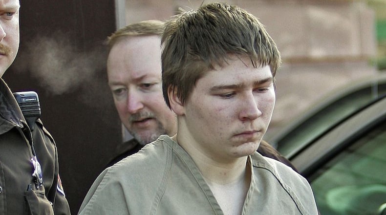 In this Friday, March 3, 2006 photo, Brendan Dassey, 16, is escorted out of a Manitowoc County Circuit courtroom in Manitowoc, Wis. A federal court in Wisconsin on Friday overturned the conviction of Dassey, a man found guilty of helping his uncle kill Teresa Halbach in a case profiled in the Netflix documentary “Making a Murderer.” (AP Photo/Morry Gash, File)