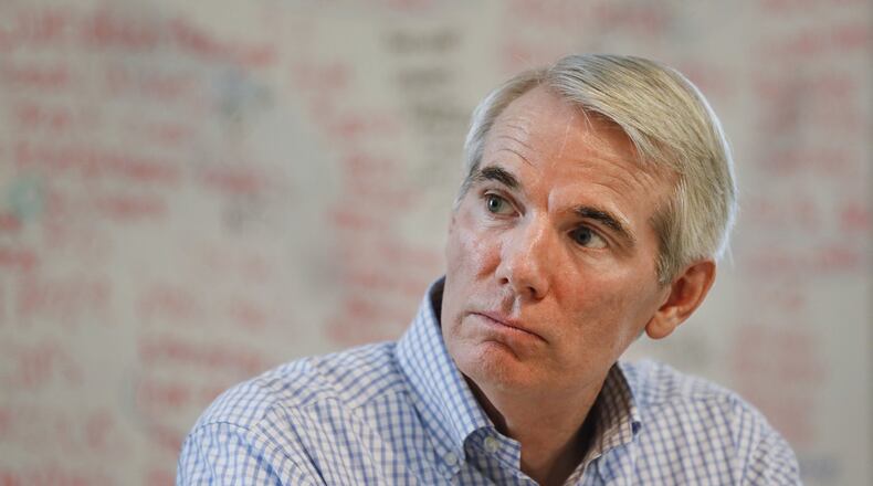 Sen. Rob Portman, R-Ohio, listens during a roundtable discussion with former addiction recovery clients and current employees at the Adams Recovery Center for Women, Wednesday, July 5, 2017, in Cincinnati. (AP Photo/John Minchillo)
