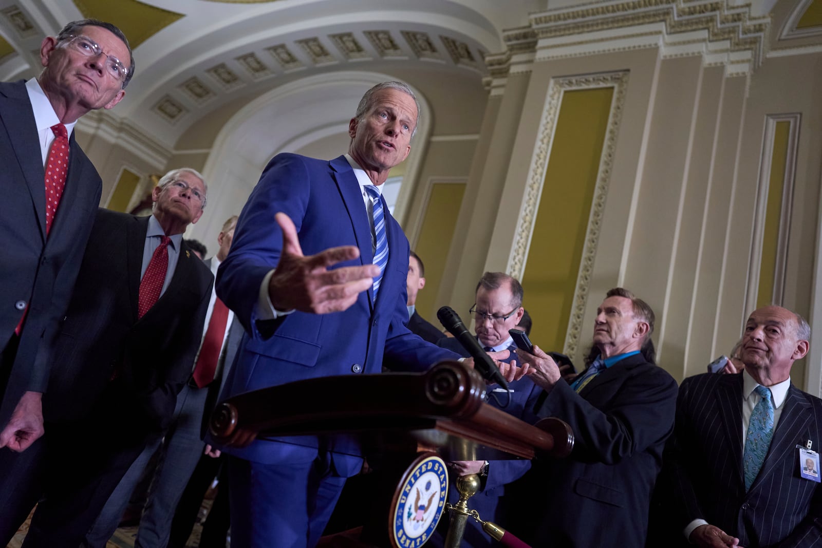 From left, Sen. John Barrasso, R-Wyo., the GOP whip, and Sen. Roger Wicker, R-Miss., chairman of the Senate Armed Services Committee, join Senate Majority Leader John Thune, R-S.D., to speaks with reporters at the Capitol in Washington, Tuesday, June 10, 2025. (AP Photo/J. Scott Applewhite)