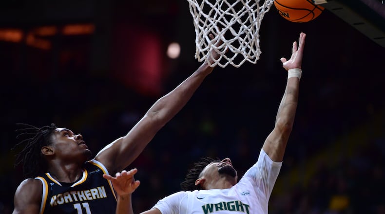 Wright State's Trey Calvin scores against NKU's Randall Pettus II during Thursday night's Horizon League quarterfinal at the Nutter Center. Joe Craven/Wright State Athletics