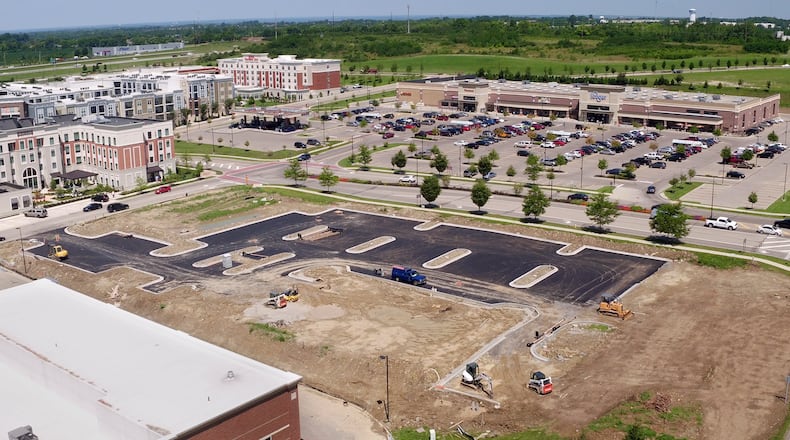 Site preparation is underway for the construction of a new Buffalo Wild Wings at Austin Landing along Springboro Pike. TY GREENLEES / STAFF