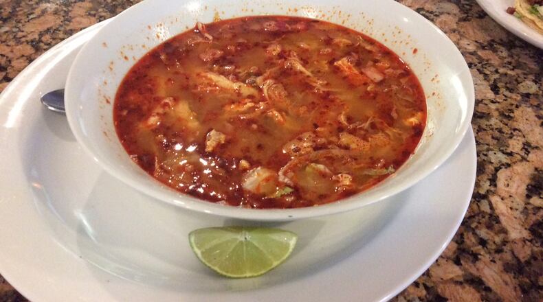 Pozole, a chicken and hominy soup with lettuce, radishes and lime, served by Chiapas Mexican Grill in Centerville. MARK FISHER/STAFF
