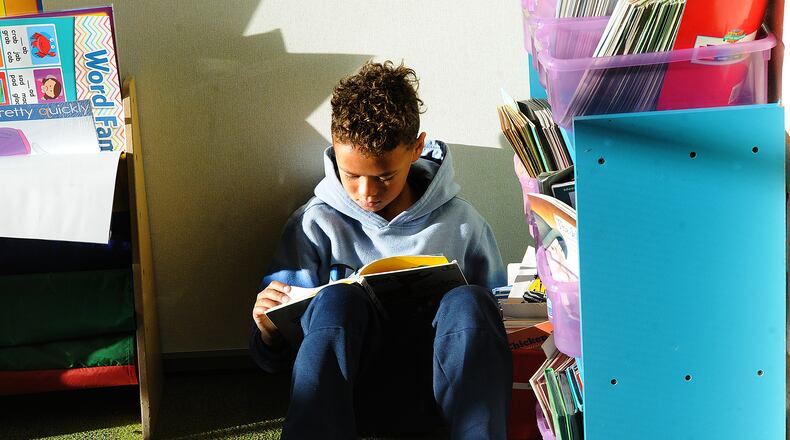 Charles Huber Elementary student Kenneth Whack reads a book in class Thursday Nov. 3, 2022. MARSHALL GORBY\STAFF
