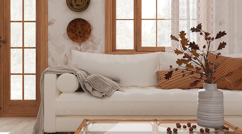 Making a home cozy can include adding warm colors, lighted candles, a fireplace and new, plush blankets. METRO NEWS SERVICE