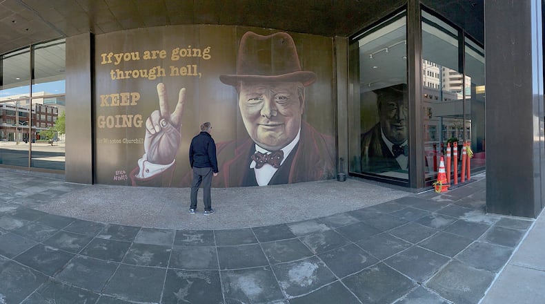 A downtown Dayton mural on the Stratacache Tower. LISA POWELL / STAFF