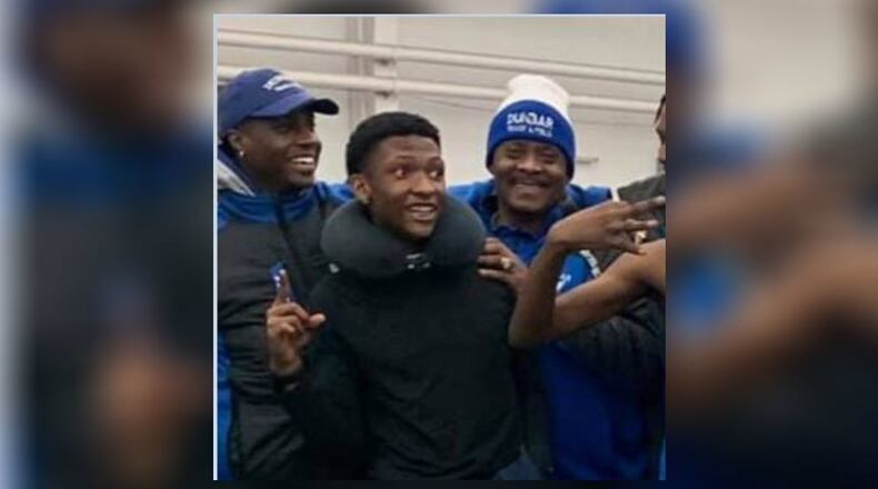 Qua'Lek Shelton (middle) with his Dunbar High School track and field teammates. (Courtesy/Coach Sidney Booker)