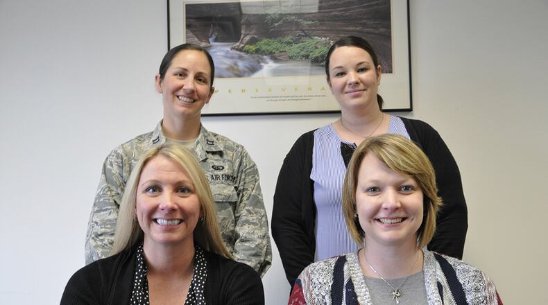 The new Wright-Patterson Air Force Base Sexual Assault Prevention and Response team includes (top left to right): Capt. Morgan Griffo, deputy sexual assault response coordinator; Annamae Willis, SAPR specialist and full-time victim advocate. Bottom left to right: April Barrows, Wright-Patterson Air Force Base installation SARC and SAPR program manager; Stephanie Wilson, SAPR specialist and full-time victim advocate. April is Sexual Assault Awareness and Prevention Month. The SAPR office will host various activities throughout the base to highlight care for victims and prevention practices. (U.S. Air Force photo/Myra Saxon).