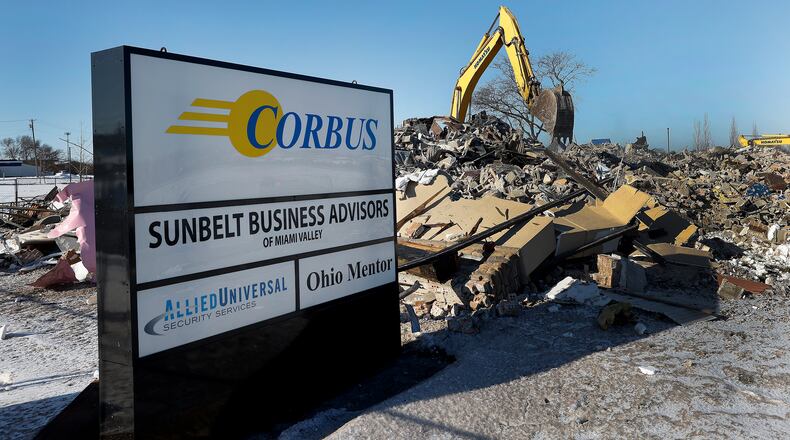 Crews work to demolish an office building at 1129 Miamisburg-Centerville Road in West Carrollton Wednesday, Jan. 15, 2025. The 3-story facility just off Interstate 75 was damaged in a November 2023 fire. MARSHALL GORBY/STAFF