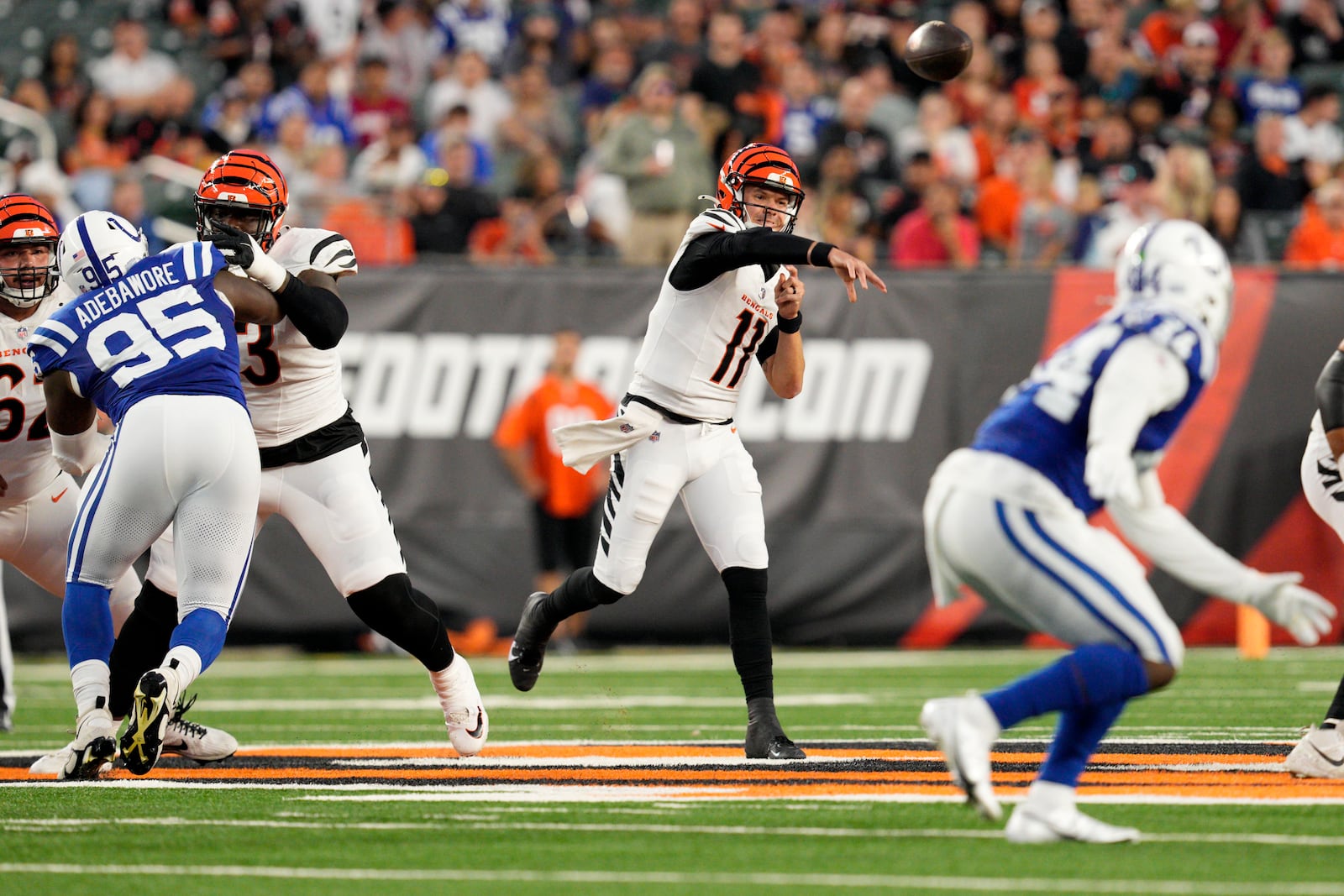 Cincinnati Bengals quarterback Logan Woodside (11) throws a pass during the first half of a preseason NFL football game against the Indianapolis Colts, Thursday, Aug. 22, 2024, in Cincinnati. (AP Photo/Jeff Dean)