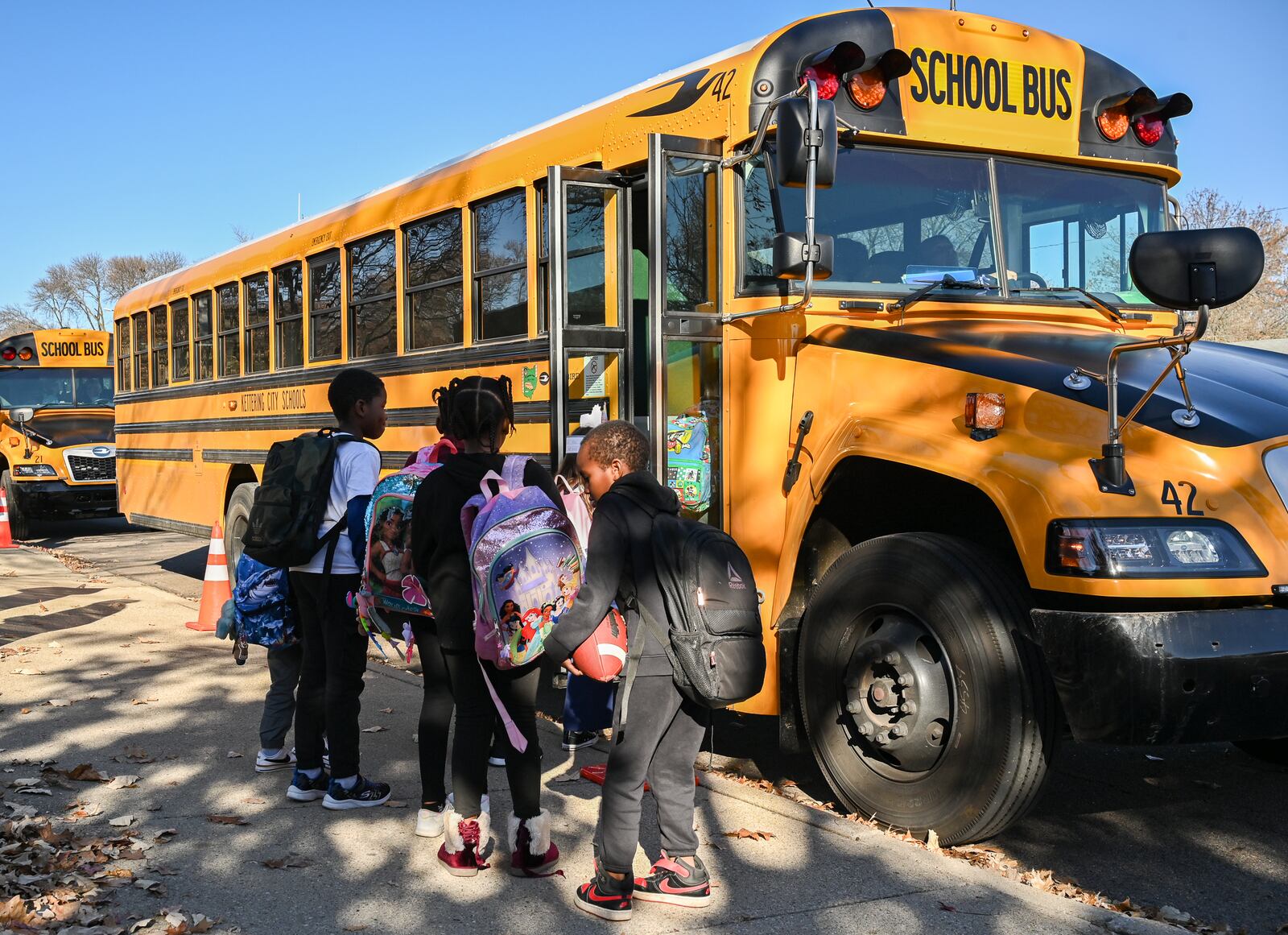 Students walk in a bus pickup lane near Oakview Elementary School on Monday, Nov. 17 in Kettering. BRYANT BILLING/STAFF