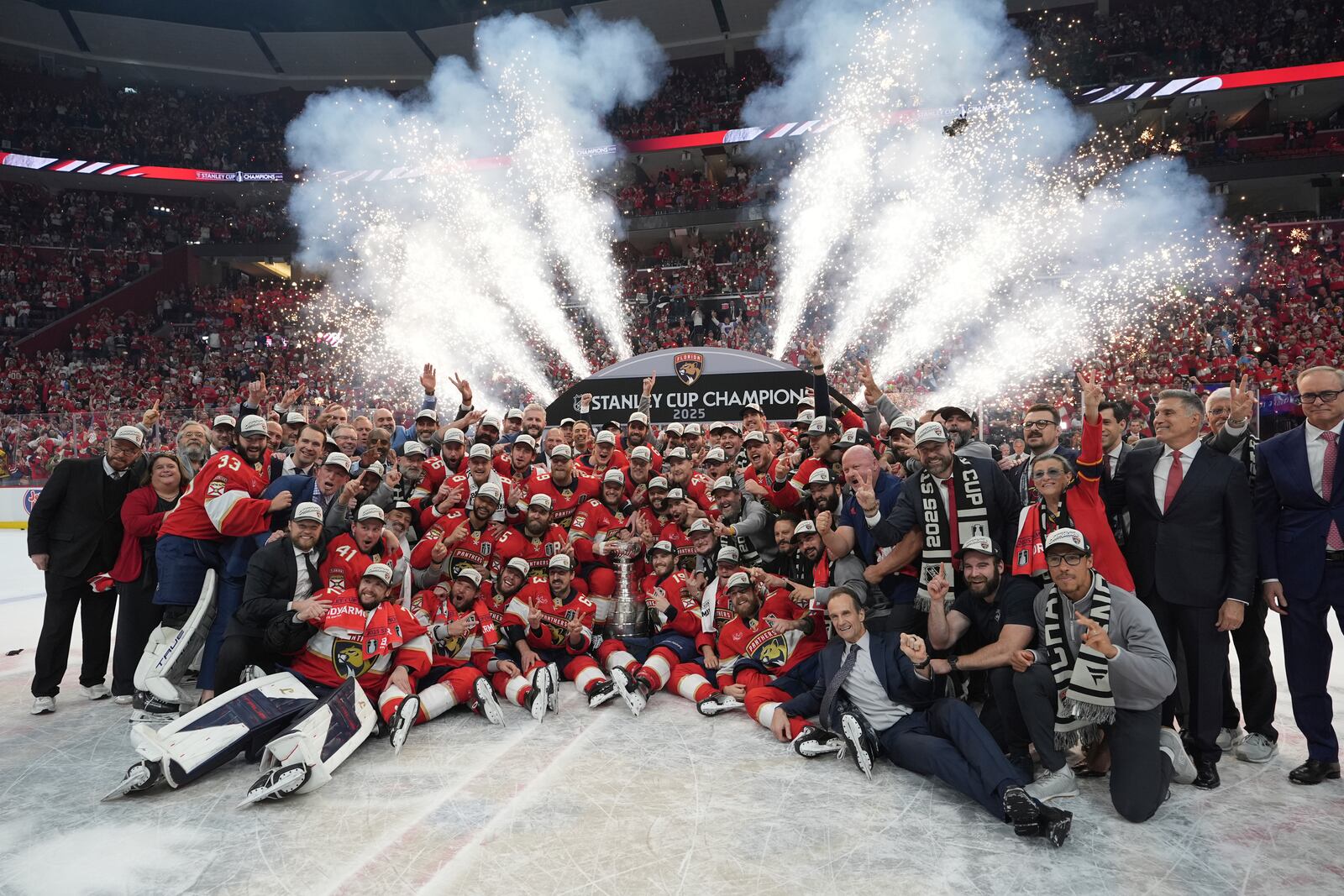The Florida Panthers team poses with the Stanley Cup trophy after defeating the Edmonton Oilers in Game 6 of the NHL hockey Stanley Cup Final Tuesday, June 17, 2025, in Sunrise, Fla. (AP Photo/Lynne Sladky)