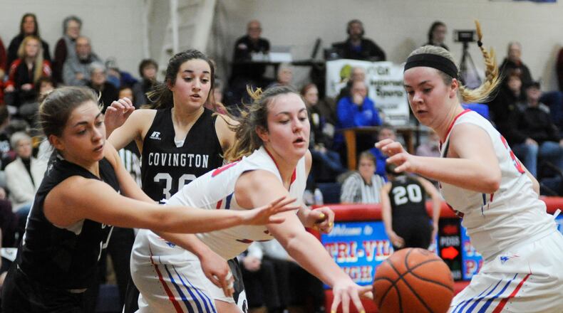 Sisters Meghan (center) and Maddie Downing (right) are the Tri-Village “Twin Towers.” MARC PENDLETON / STAFF