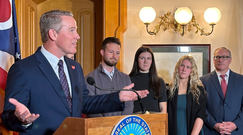 Republican Ohio Lt. Gov. Jon Husted is joined by his family as he speaks at a news conference on Friday, Jan. 17, 2025, in Columbus, Ohio, announcing his appointment to fill the U.S. Senate seat formerly held by Vice President-elect JD Vance. (AP Photo/Julie Carr Smyth)