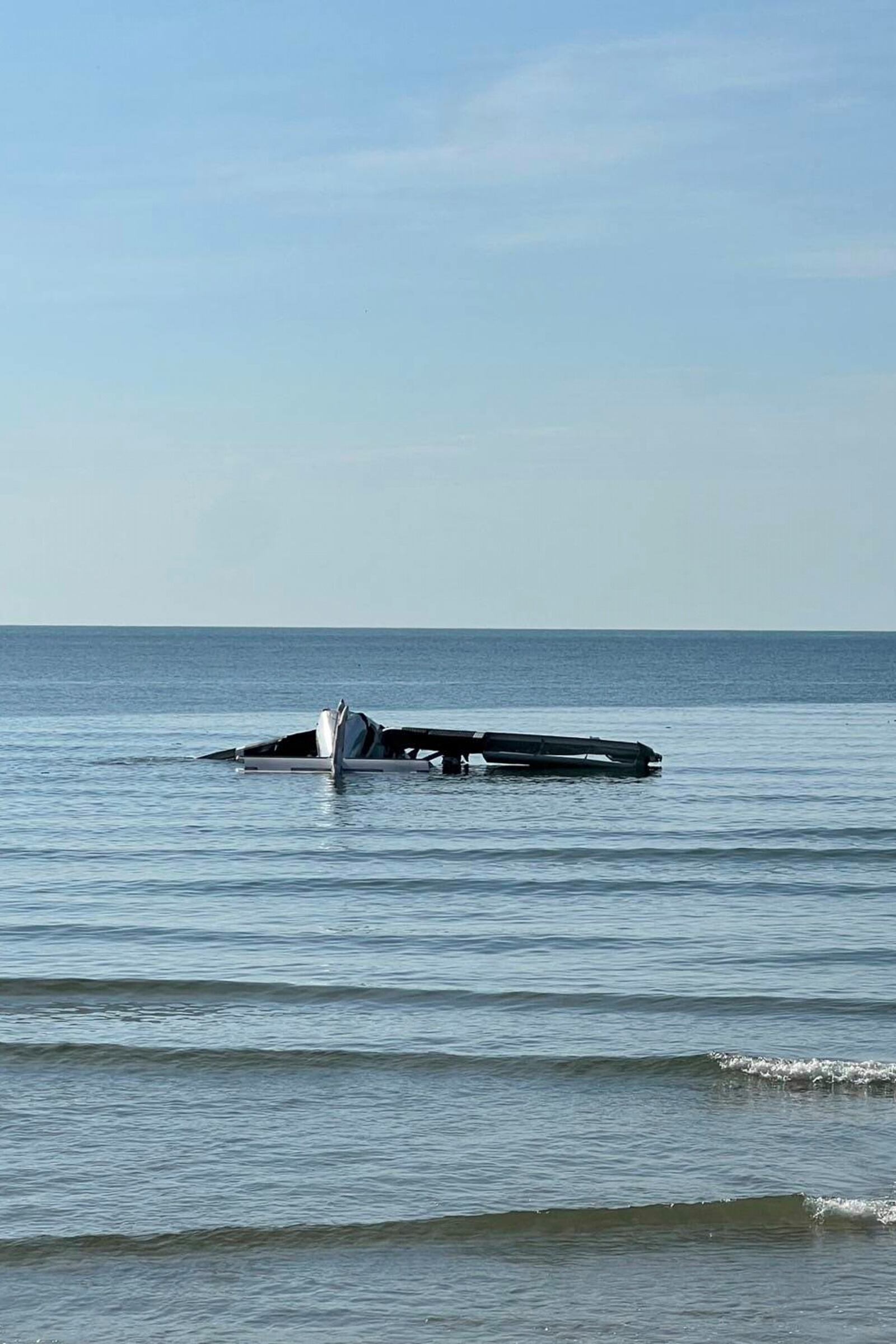 In this photo provided by the Royal Thai Police, a small police plane is seen crashed into the sea killing multiple people on board in Prachuab Kiri Khan province, western of Thailand, Friday, April 25, 2025. (Royal Thai Police via AP)