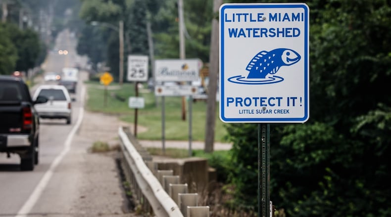 Sugar Creek runs on the north end of Tom's Mulch property. The state of Ohio is suing the Bellbrook landscaping company over alleged polluting of Sugar Creek. JIM NOELKER/STAFF