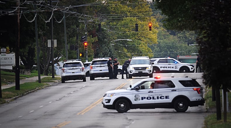 A man is in critical condition after he was shot by police on Wayne Avenue in Dayton on Thursday, Sept. 24, 2020. STAFF PHOTO / MARSHALL GORBY