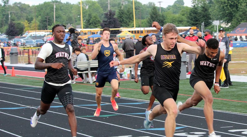Butler's Jordan Gross (middle) wins the 200 during the during the Division I Region 4 track finals at Wayne's Heidkamp Stadium. HENRY S. CONTE / CONTRIBUTED PHOTO