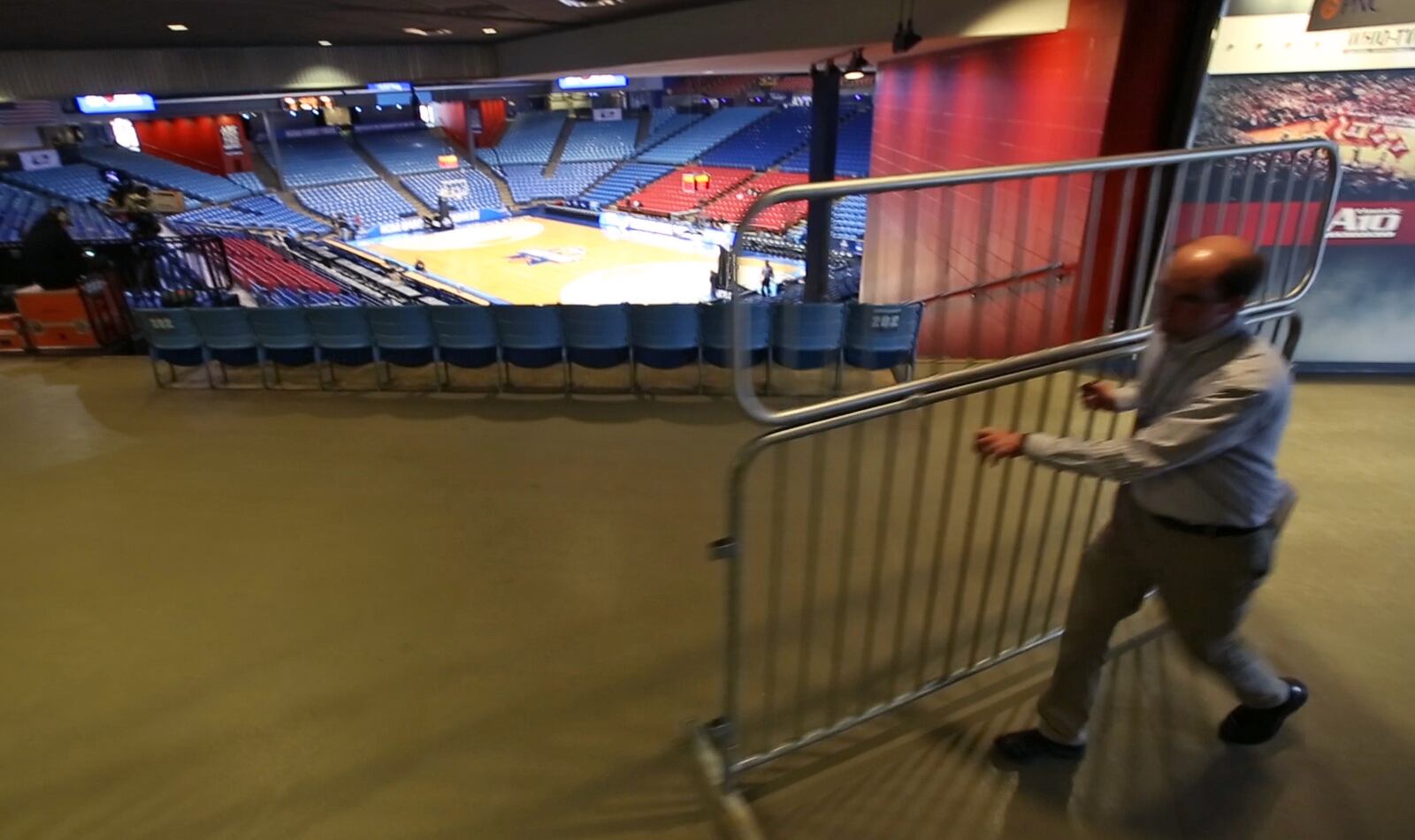 Gates are removed from the ticked office before the NCAA Tournament First Four teams practice at UD Arena on Monday evening.  TY GREENLEES / STAFF