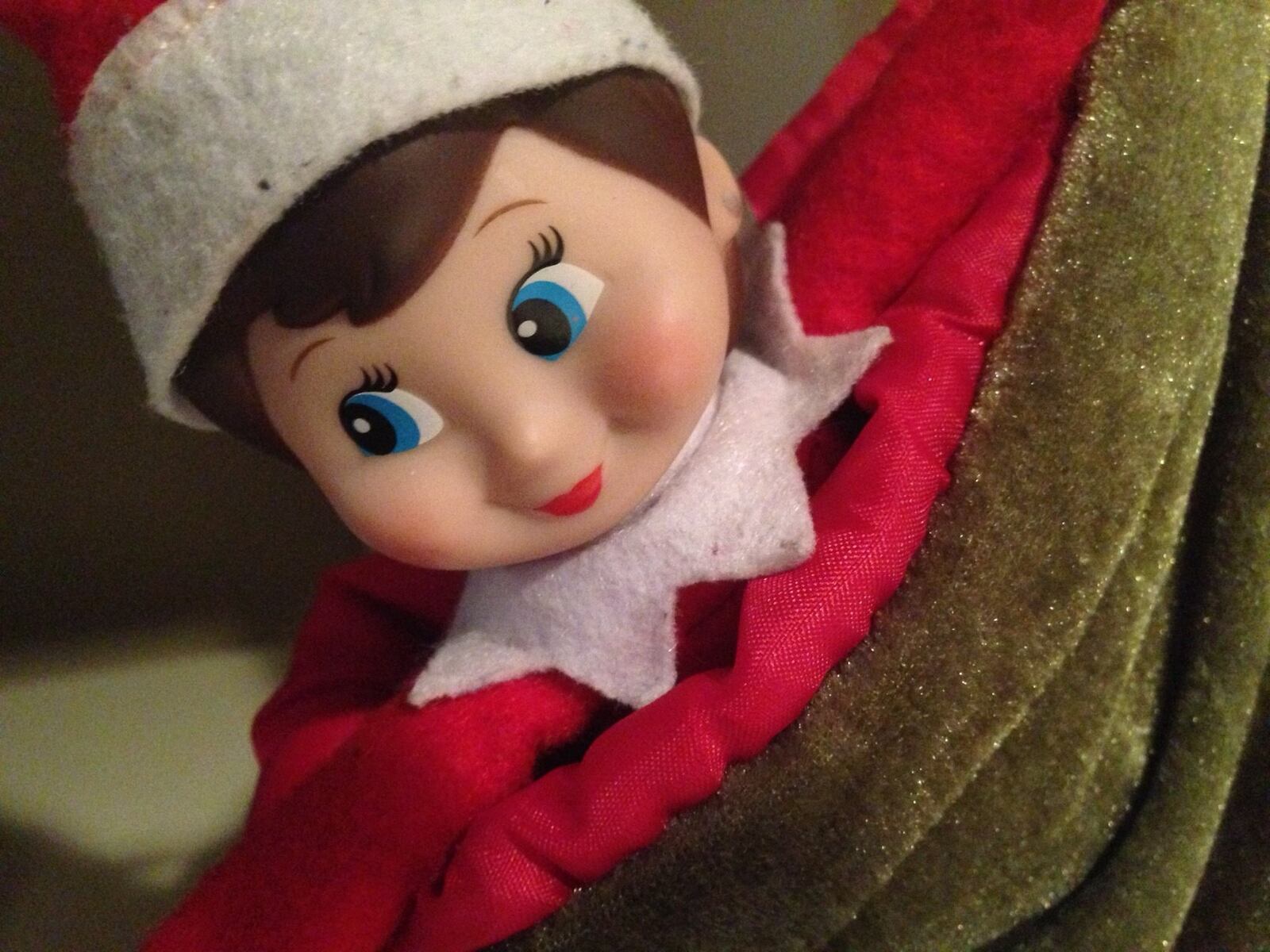 Hiding in plain sight helps an Elf on the Shelf do her job. Here she is, waiting patiently to be discovered by a child who isn’t bothering to look for her. NEDRA RHONE / NRHONE@AJC.COM