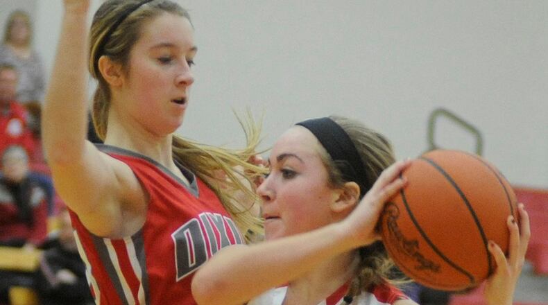 Newton’s Tatum McBride (with ball) is the All-SW District D-IV girls player of the year. MARC PENDLETON / STAFF