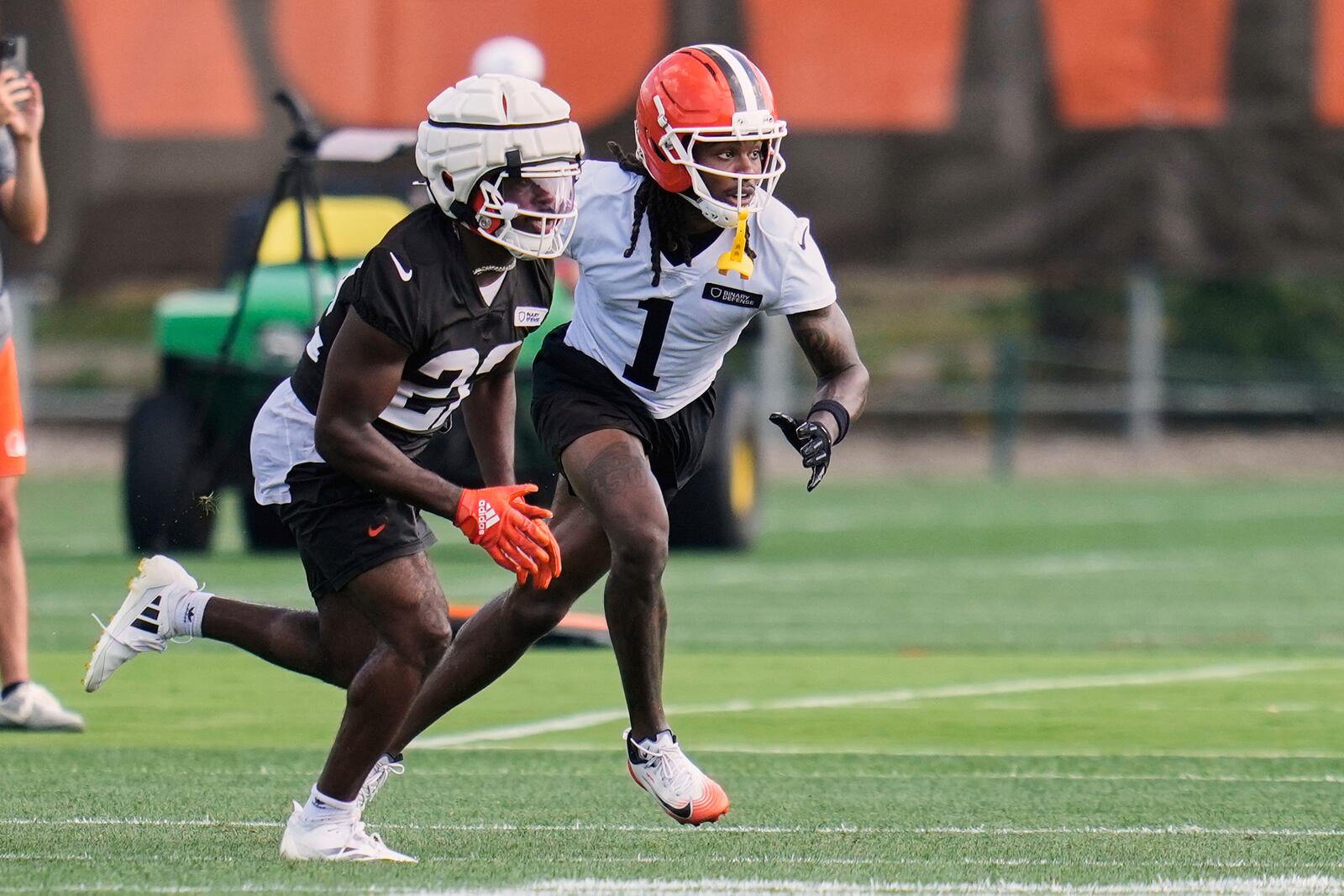 Cleveland Browns running back Dylan Sampson, left, and cornerback Martin Emerson Jr. (1) participate in a drill during a practice at the team's NFL football training camp Thursday, July 24, 2025, in Berea, Ohio. (AP Photo/Sue Ogrocki)